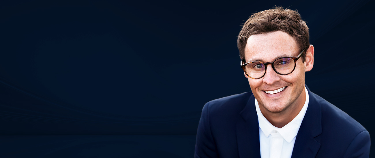 Kevin M. Bowen with a dark blue background